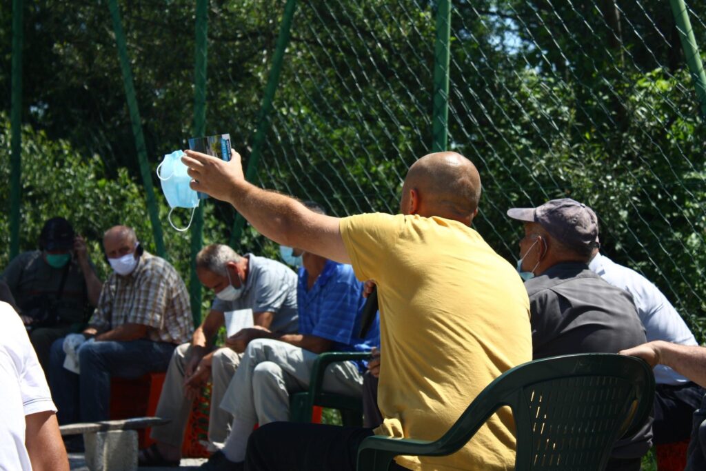Member of the audience raising his voice