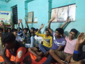 Youth raising their hands to answer to a question