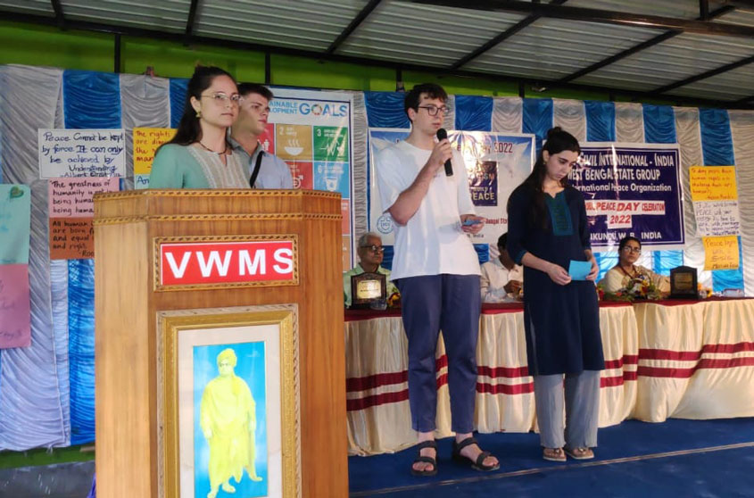 A group of people on the podium reciting potery