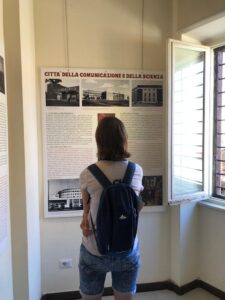 A person looking at the poster