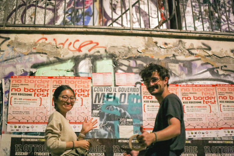 Two people smiling at the camera