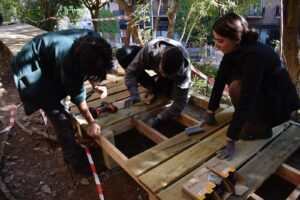 People building a wooden structure