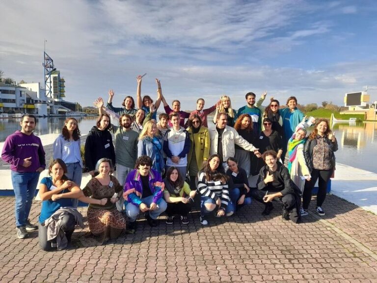 Training participants in front of lake
