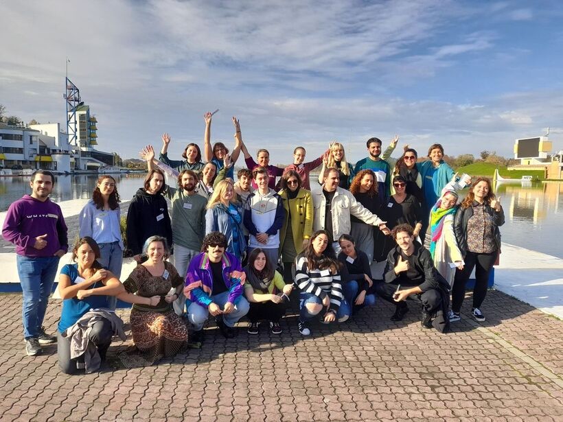 Training participants in front of lake
